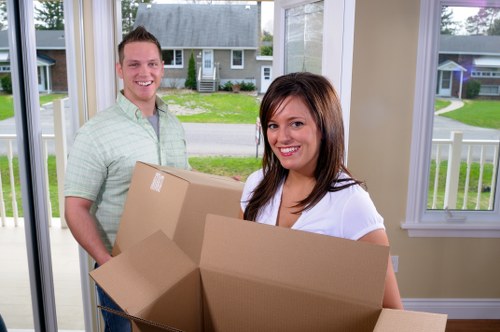 Moving team preparing equipment and packing materials safely